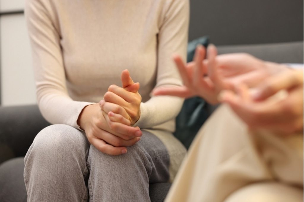 Close up of patient hands during psychiatry consultations care in Houston, TX session for trauma and stress relief.