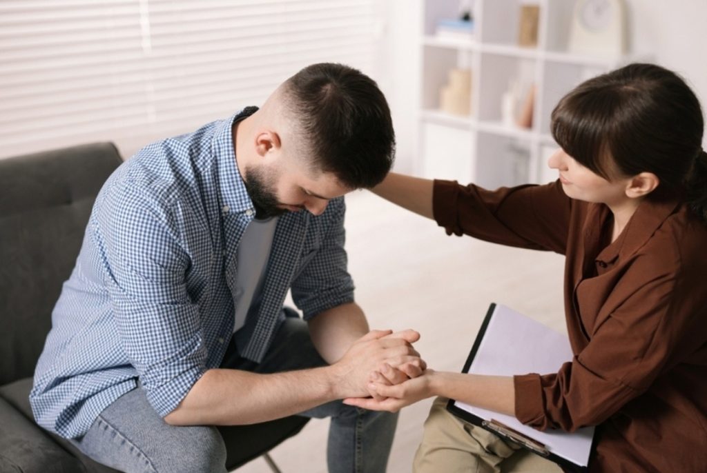 Caring specialist providing psychiatry consultations care in Houston, TX for a man in an emotional mental health crisis.