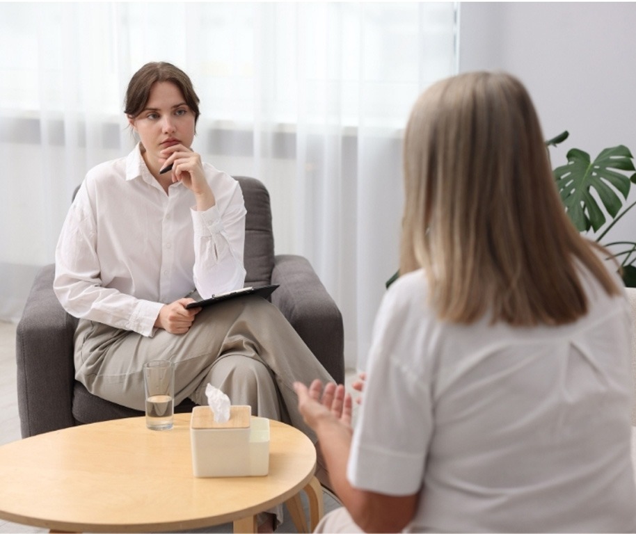 Female doctor conducting professional psychiatry consultations care in Houston, TX for a patient in a private clinic.