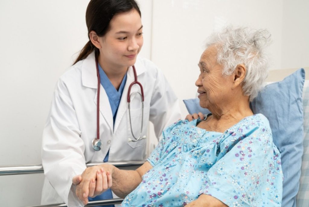 Compassionate doctor providing preventive and wellness care in Houston for a senior patient during a routine health exam