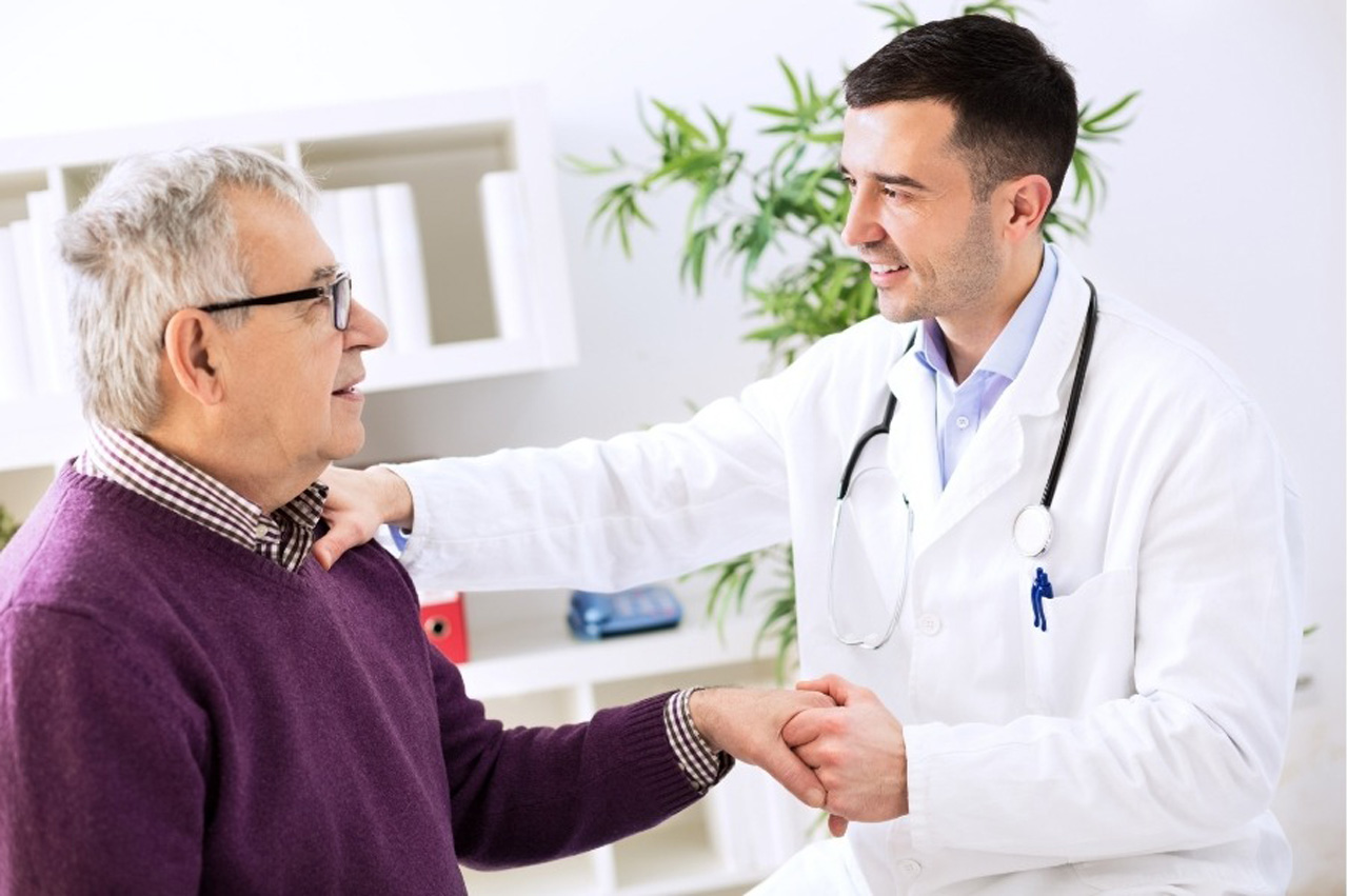 Doctor shaking hands with a senior man during a successful preventive & wellness care in Houston consultation