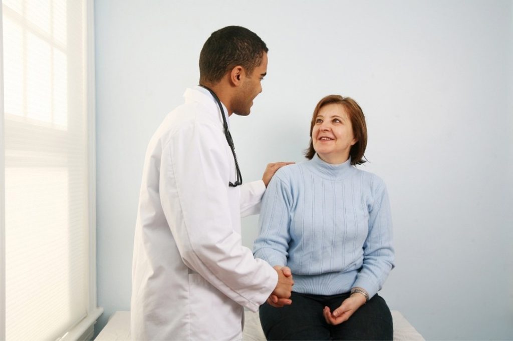 Male physician shaking hands with a patient before starting their personalized cardiology care in Houston, TX session.